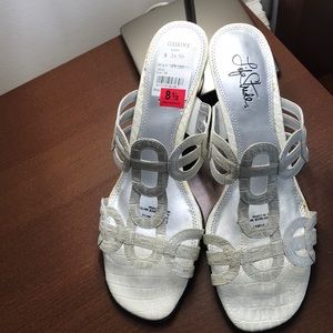 Shoes. White with shine. Never worn. About 2 inche